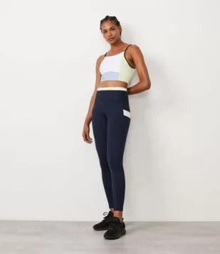 CALÇA LEGGING EM POLIAMIDA COM CÓS CONTRASTANTE E BOLSINHO LATERAL AZUL