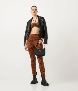 CALÇA LEGGING EM JACQUARD COM FENDAS E ESTAMPA ANIMAL PRINT ONÇA LARANJA