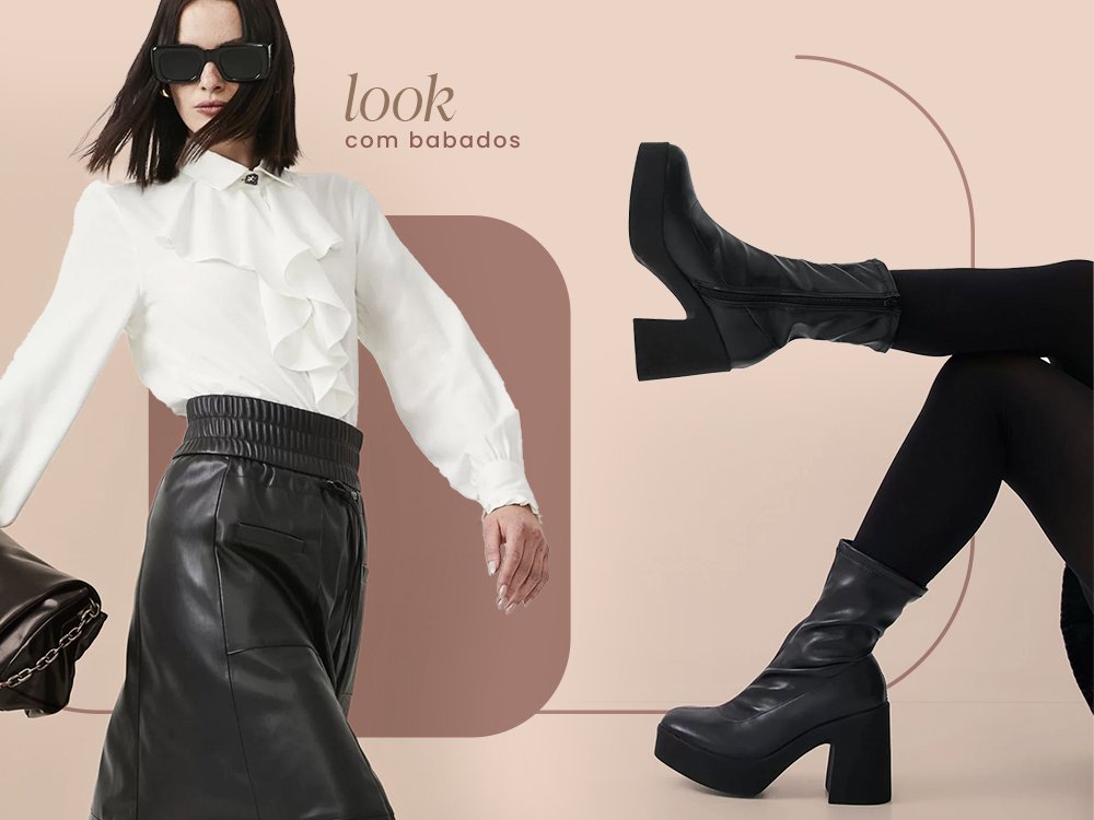 Mulher vestindo uma camisa branca com babados branco, uma saia midi preta, um óculos de sol preto e uma bolsa preta. Ao lado uma bota chelsea preta.