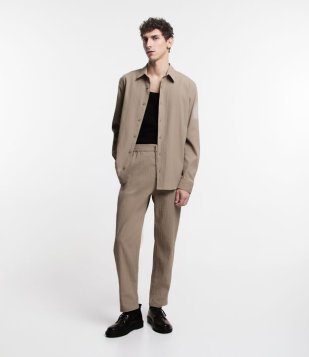 Calça Relaxed Em Ana Ruga Com Cintura Elástica Bege